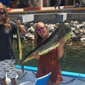 Chynna Deese and Lucas Fowler holding fish on a boat