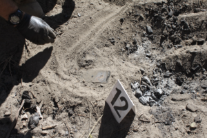 Partially buried object at the crime scene. Courtesy: Plumas County District Attorney’s Office