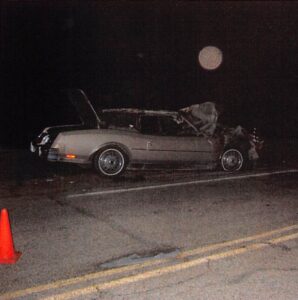 Crumpled car at Moab Fault overlook crime scene in August 2004 Source: Grand County Sheriff’s Office