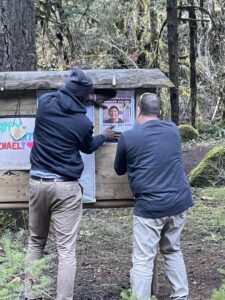 Parrish Bryson and associate hanging posters about Michael’s case Courtesy: Tina and Parrish Bryson
